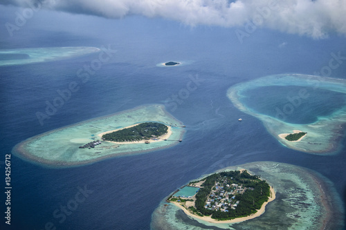 Maldives from above while flying from Male to Raa Atoll. photo