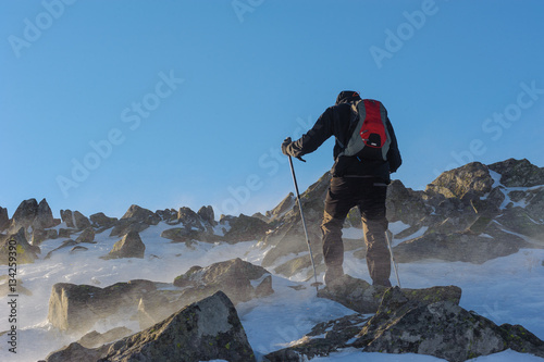 Man doing a trekking high in the mountains in Poland.