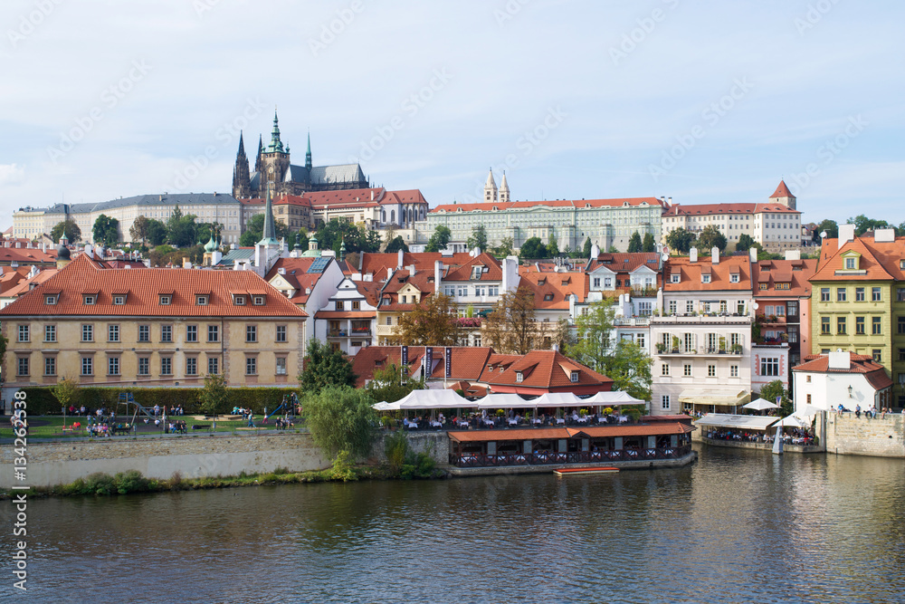 Buildings along the Vltava River under Prague Castle