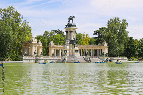 Beautiful of tourists on boats at Monument to Alfonso XII in the Parque del Buen Retiro, Park del Retiro, Madrid, Spain