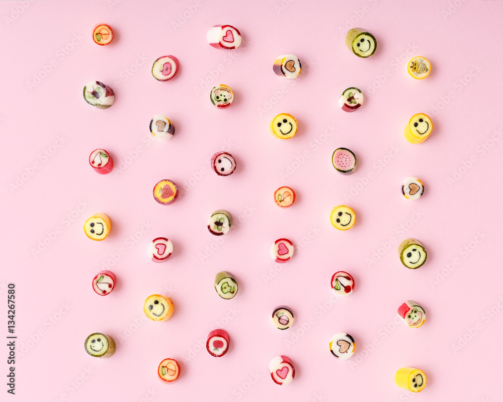 lollipops, candy pattern, top view flat lay on colorful backgrou