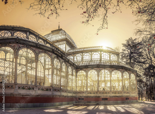 Crystal Palace building under evening sunlight at Retiro Park in the city of Madrid, Spain