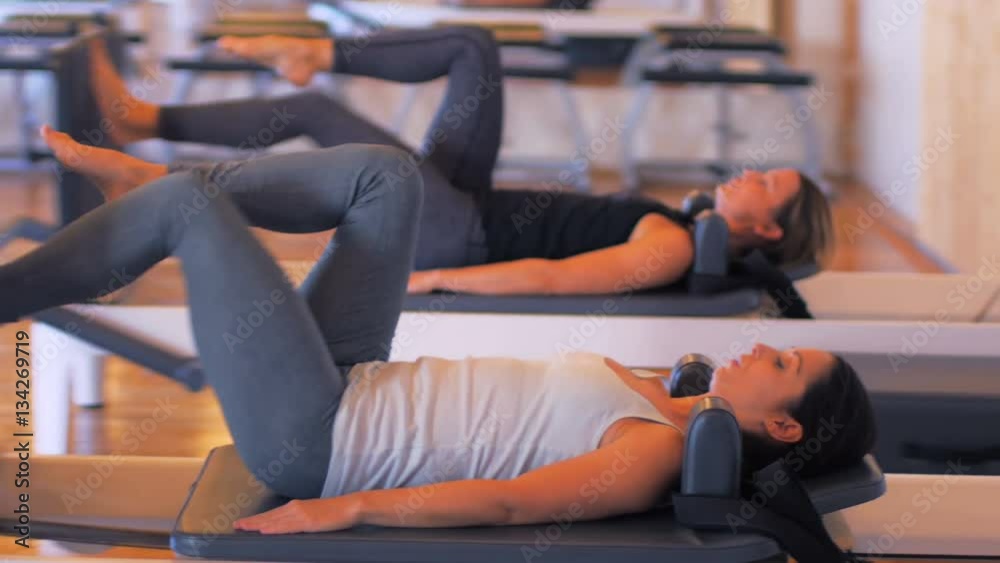 Women exercising on gym equipment