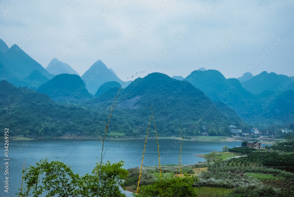 The mountains and rural scenery in the mist 