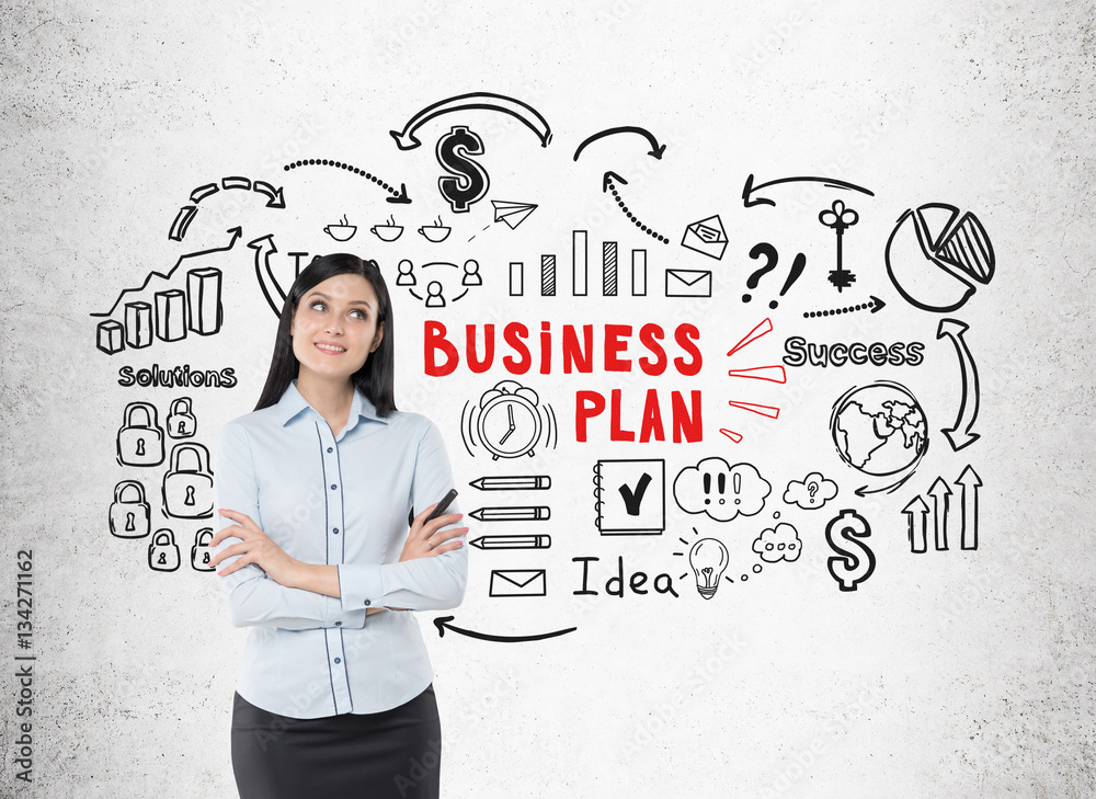 Positive woman in blue shirt and business plan Positive woman in blue shirt and business plan