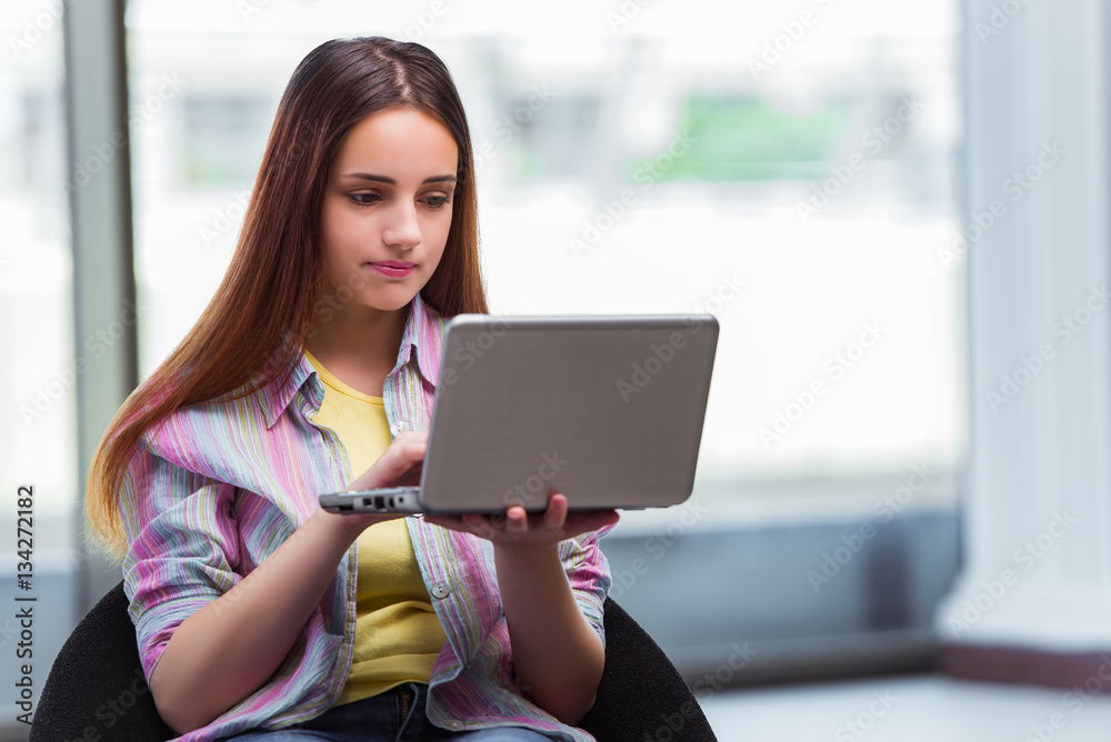 Young girl surfing internet on laptop Young girl surfing internet on laptop