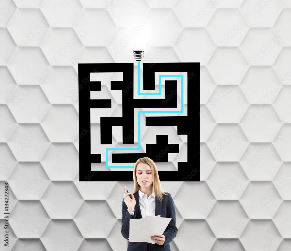 Blond woman near a maze sketch