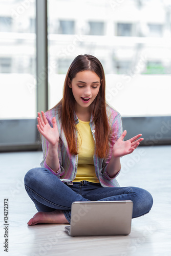 Young girl surfing internet on laptop Free Download Young girl surfing internet on laptop - GFXLoad