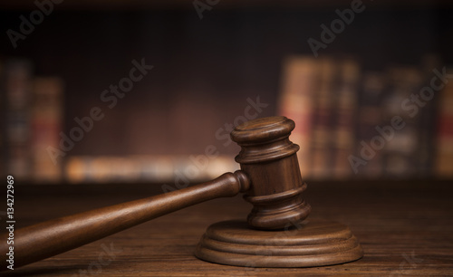 law theme, mallet of the judge, justice scale, books, wooden des