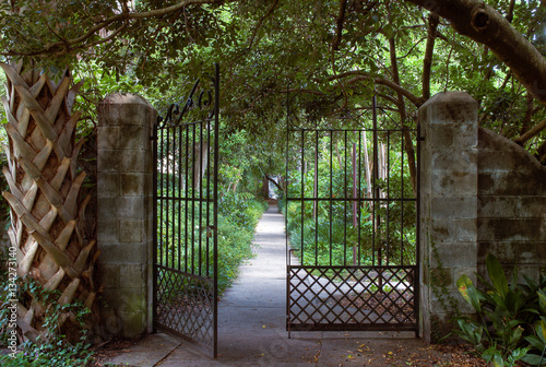 open gate leading to sidewalk