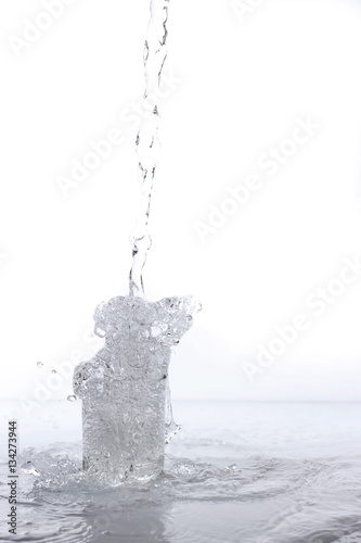 water splashing from glass isolated on white background