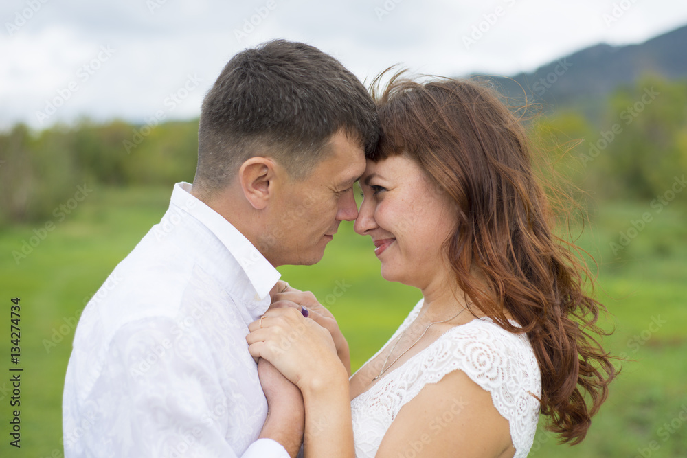 Lovers man and woman on a date in nature. Lovers man and woman on a date in nature.