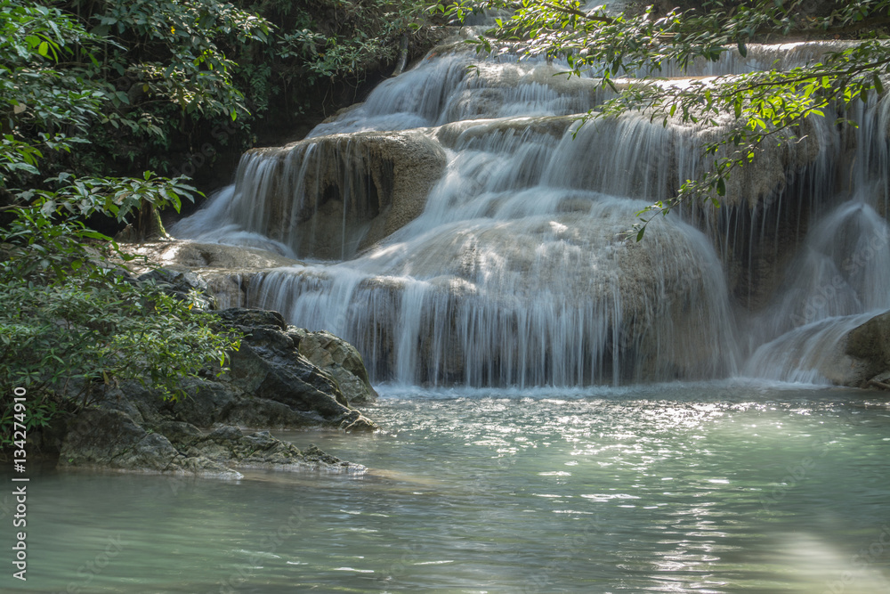 Naklejka premium Erawan Falls are big and beautiful in Kanchanaburi Province Thailand has a large garden with beautiful trees.