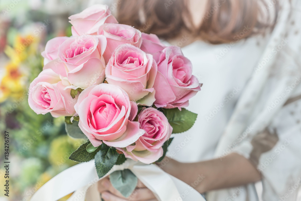 Hands holding bouquet of flower Hands holding bouquet of flower