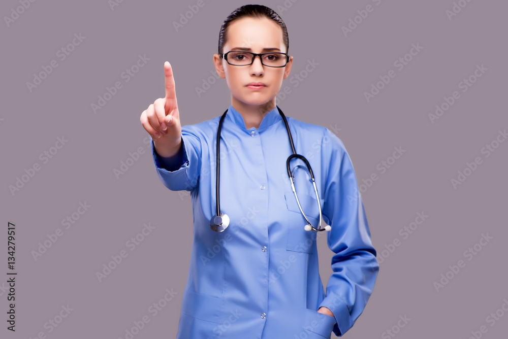 Young doctor pressing virtual button Young doctor pressing virtual button