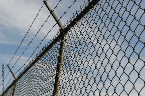 iron chain link fence and blue sky © nd700
