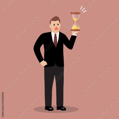 Businessman holding sandglass