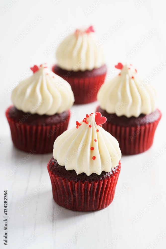 colorful cupcakes on white wooden background