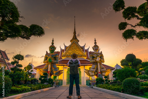 Tourist is watching landmark inside Wat Arun in Bangkok, Thailand. photo