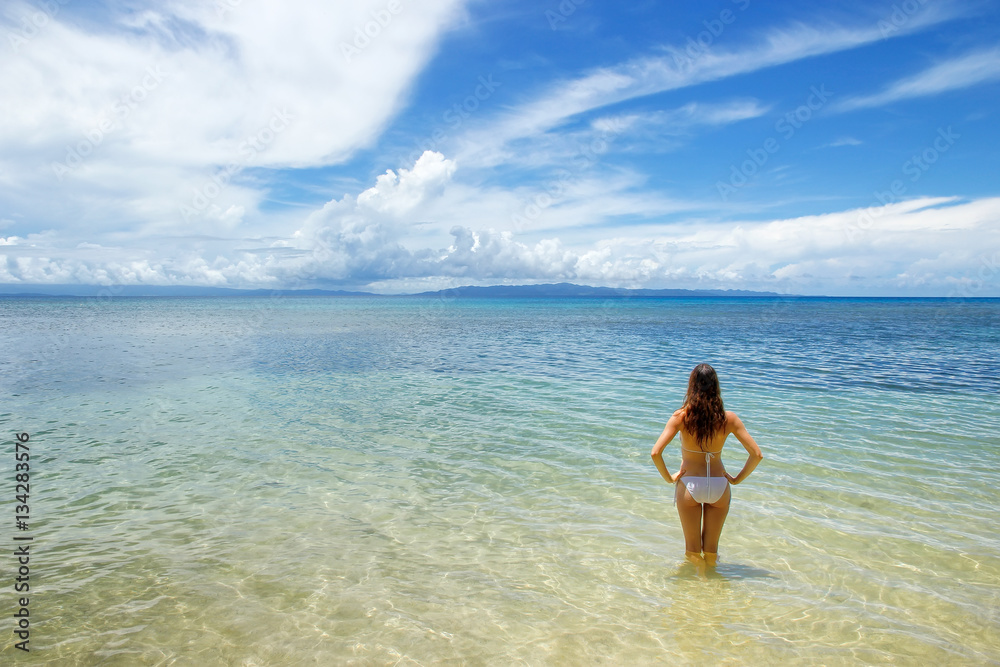 Young woman in bikini standing in clear water on Taveuni Island, Young woman in bikini standing in clear water on Taveuni Island,