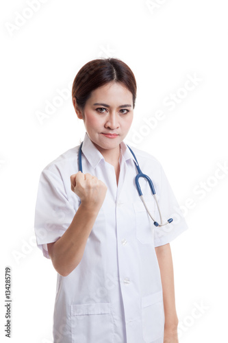 Portrait of confidence Asian young female doctor hold fist.