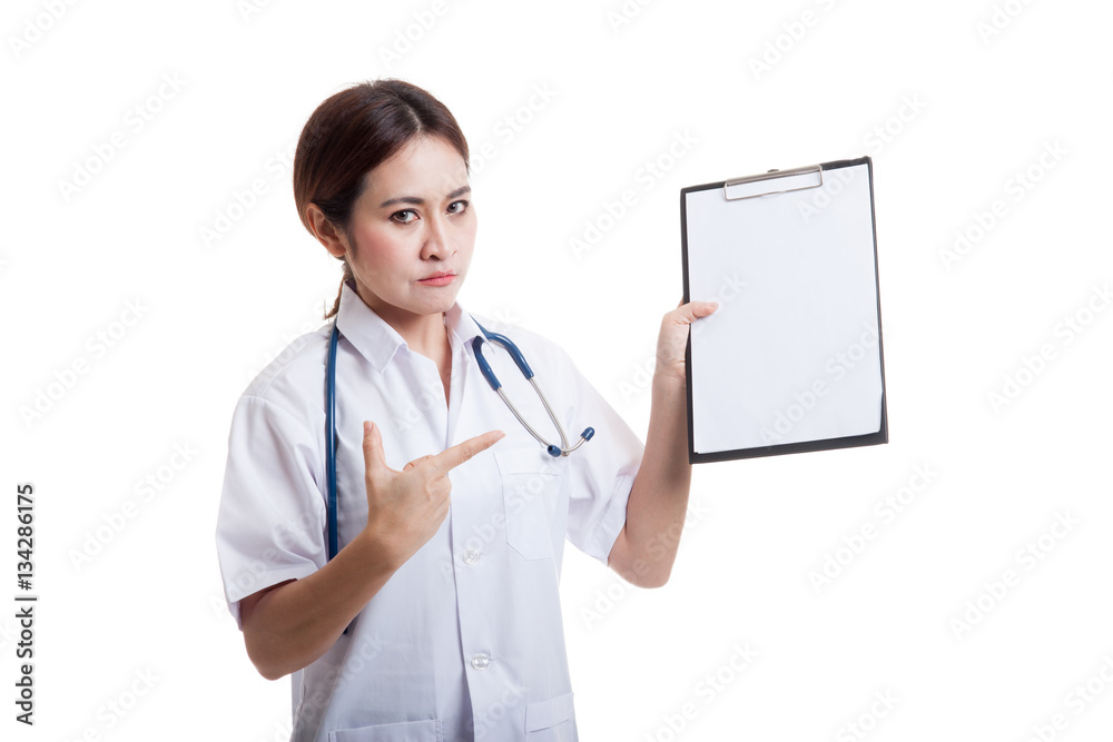 Angry Asian young female doctor point to blank clipboard. Angry Asian young female doctor point to blank clipboard.
