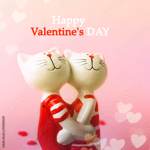 Cats - beautiful couple embrace on a pink background with hearts. Valentine's Day. Love