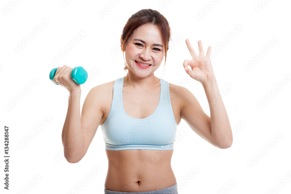 Beautiful Asian healthy girl show OK with dumbbell. Beautiful Asian healthy girl show OK with dumbbell.