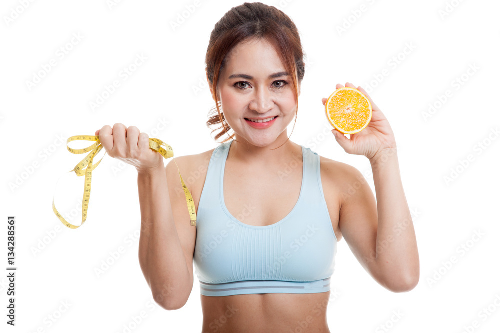 Asian healthy girl on diet with orange fruit and measuring tape. Asian healthy girl on diet with orange fruit and measuring tape.