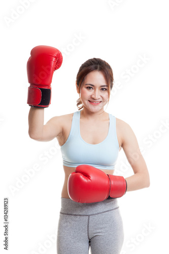 Beautiful healthy Asian girl with red boxing glove.