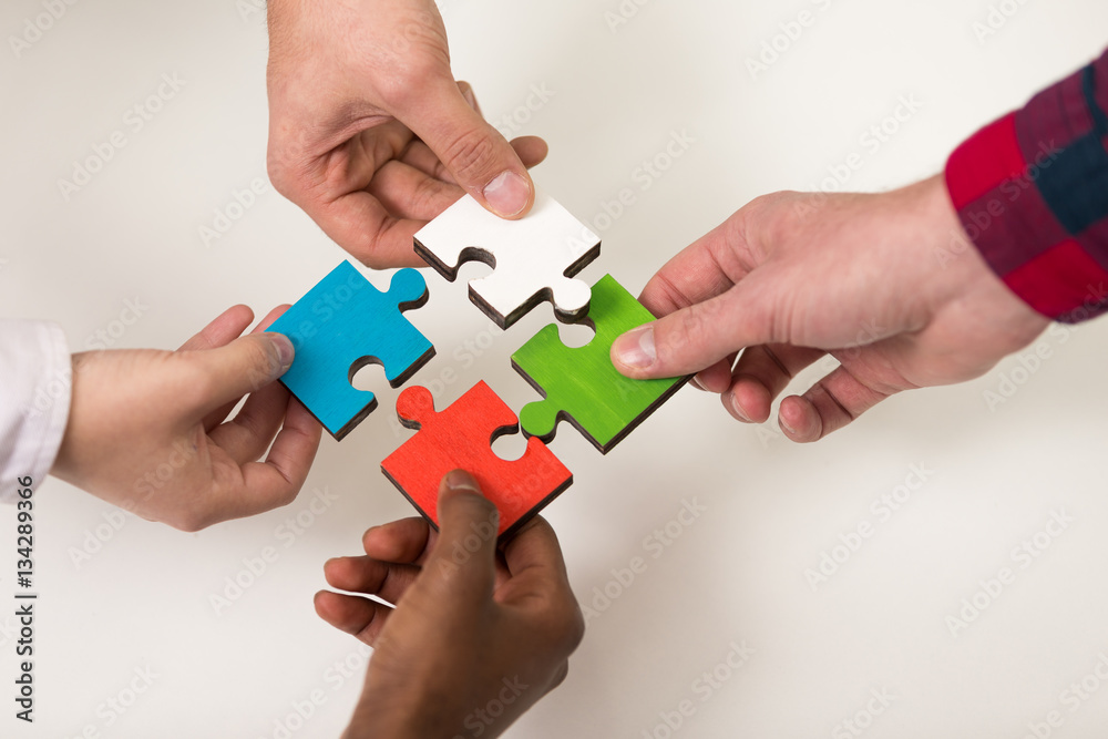 business people group assembling jigsaw puzzle and represent team support business people group assembling jigsaw puzzle and represent team support
