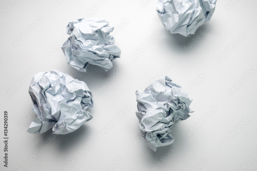 clumped paper ball on paper, white background clumped paper ball on paper, white background
