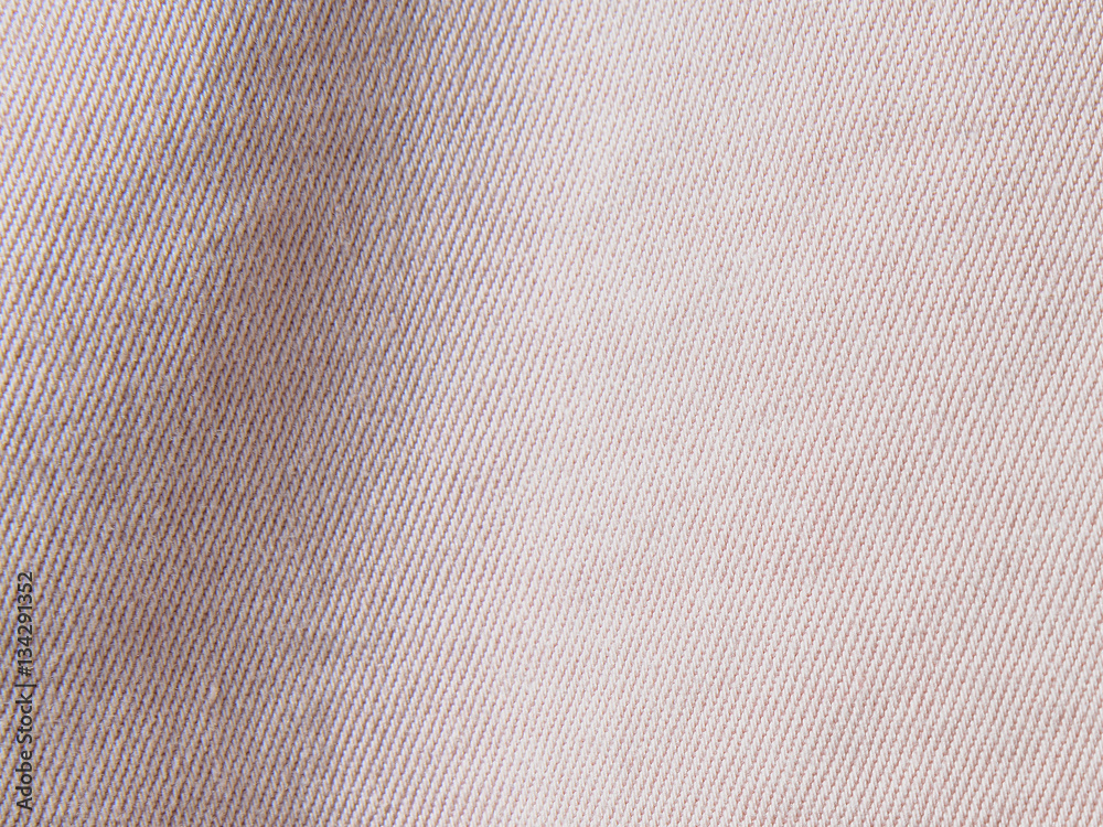 Closeup Of Pale Pink Denim Fabric Jeans Background Texture With