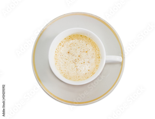 Coffee with cream in white cup on a light background