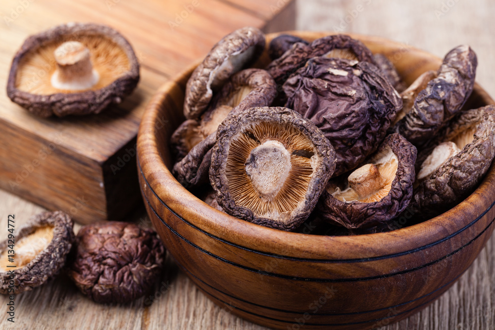 Fototapeta premium dried shitake mushroom on a wooden table