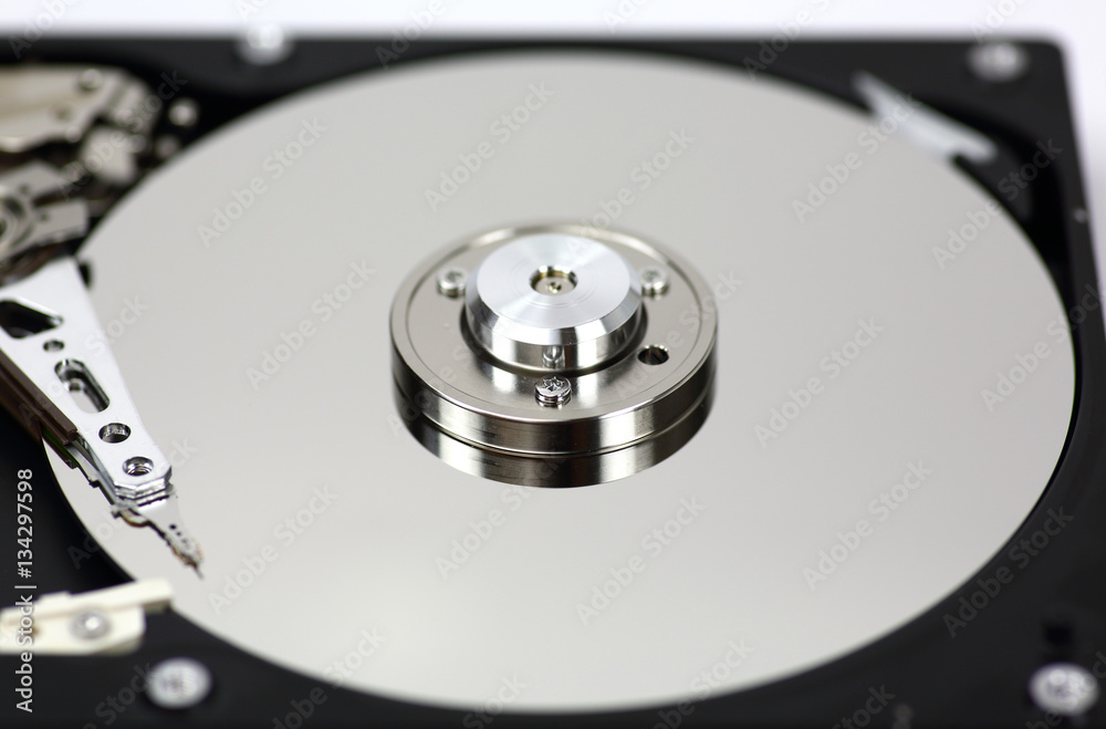 Harddisk drive (HDD) with top cover open isolated on white background Harddisk drive (HDD) with top cover open isolated on white background