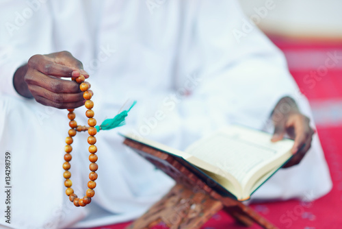 African Muslim Man Making Traditional Prayer To God While Wearing Dishdasha