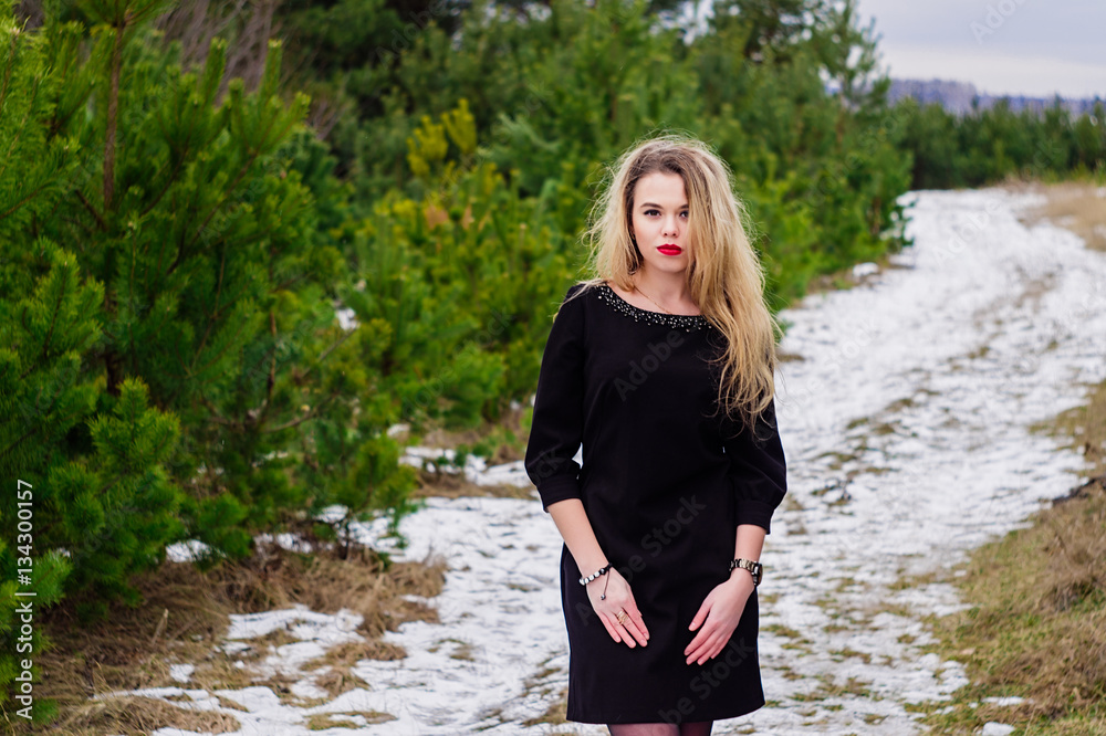 Girl posing in pines