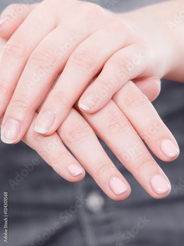 Woman presents hands nails.