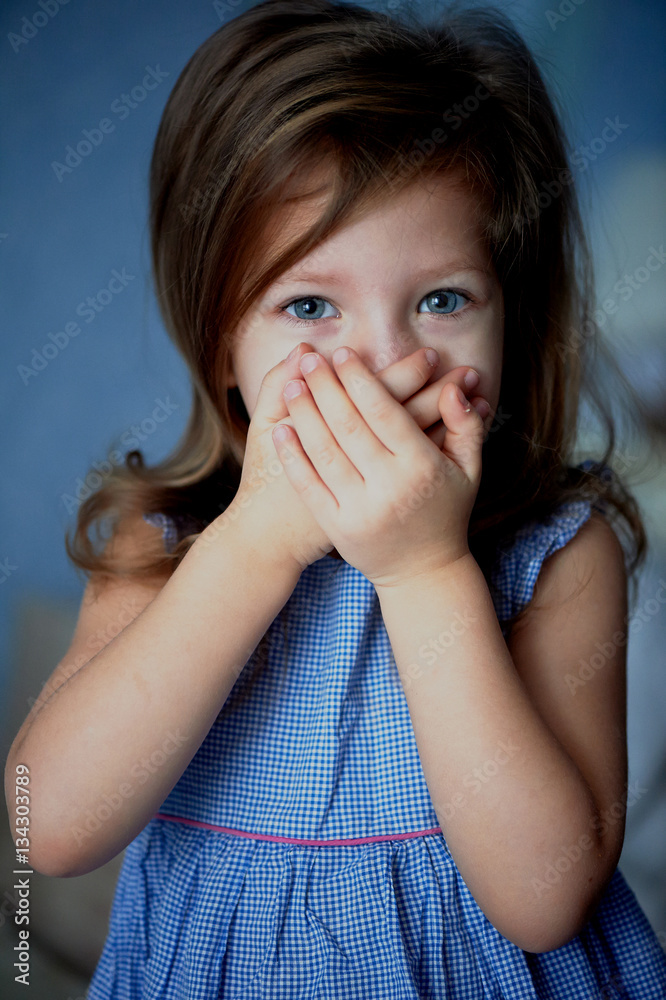 Speak no evil . Baby covers mouth with hands Speak no evil . Baby covers mouth with hands