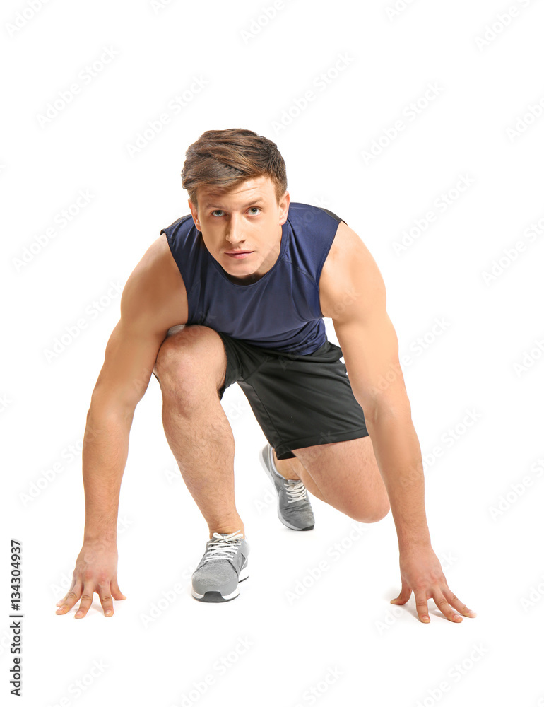 Young handsome sportsman doing exercises on white background Young handsome sportsman doing exercises on white background