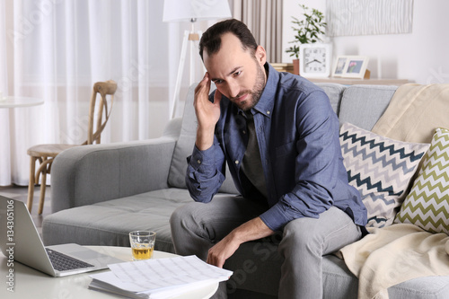 Handsome depressed man with...