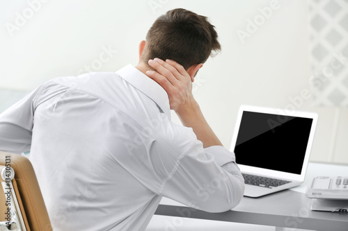 Man suffering from neck pai...