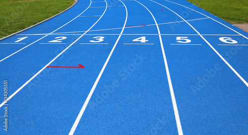 lanes of a athletic track with numbers one two three four five s