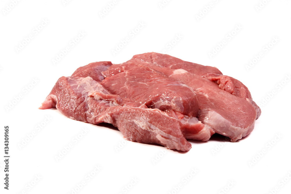 Raw pork meat (hind leg) cut into slices lying on a white backgr