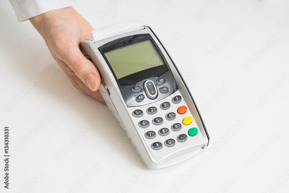 Hand holds payment terminal on white background. Hand holds payment terminal on white background.