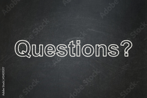 Learning concept: Questions? on chalkboard background