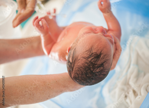 Newborn baby first bath