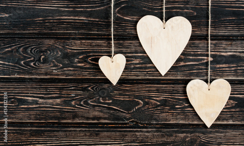 Wood hearts on wood background