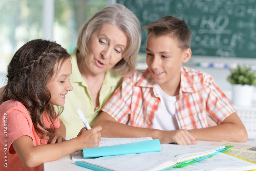 granny with grandchildren doing homework granny with grandchildren doing homework